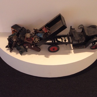 Cast metal miniature cars in Machina section.